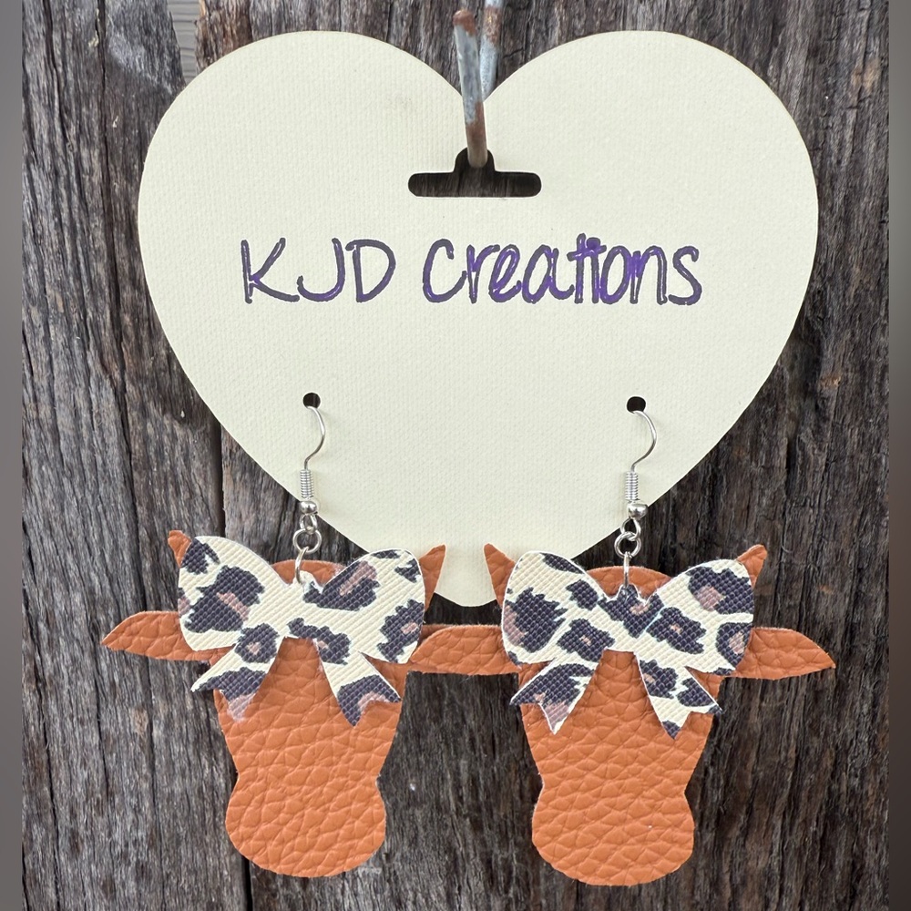 Faux leather dangle brown cow head Earrings with leopard print bow accent